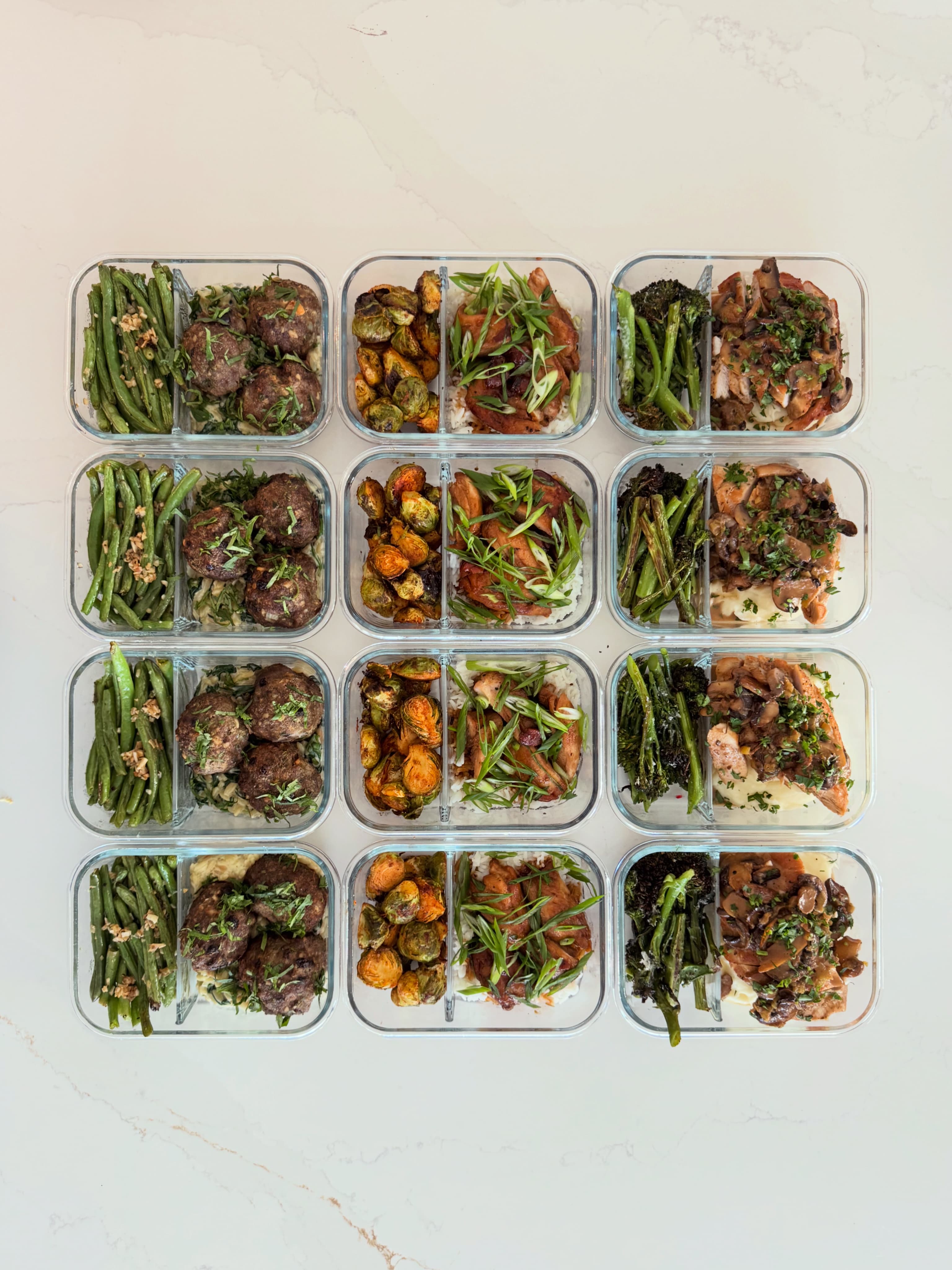 A full spread of weekly meal prep containers prepared by Eats by ATX